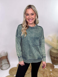 Zenana Ash Jade Green Acid Washed Raw Hem Pocket Pullover with raw edge seams, chest and side pockets, ribbed wrist and hem detailing, and a cozy relaxed fit.