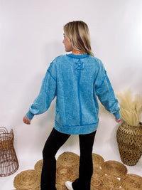 blue acid washed fleece pullover sweatshirt with exposed seams