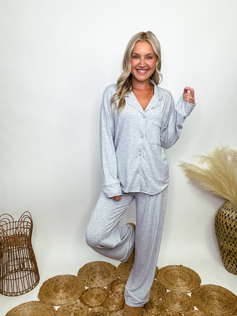 Zenana heather grey pajama set featuring a button-down long sleeve shirt and long pants with an elastic waist, true to size relaxed fit. Model Brooke is 5'4" wearing size small.