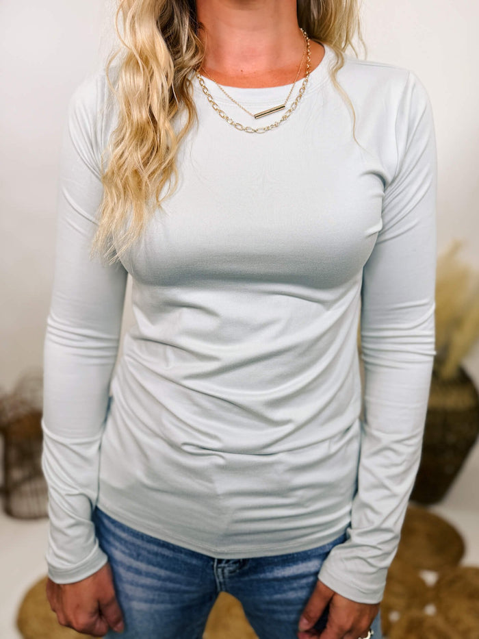 Zenana Light gray round neck long sleeve top with a fitted design, perfect for layering or wearing on its own.